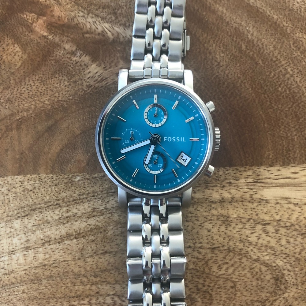 Turquoise and silver fossil watch.
